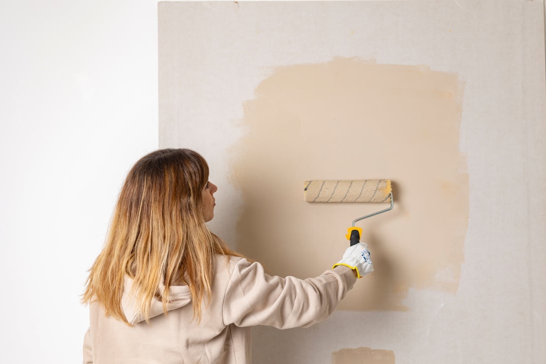 Woman Painting the Wall